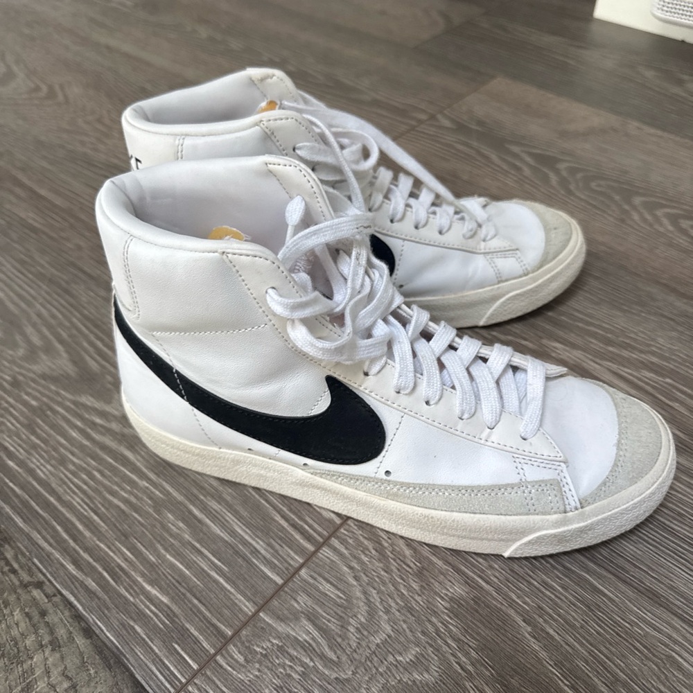 Nike White High-Top Sneakers with Black Swoosh